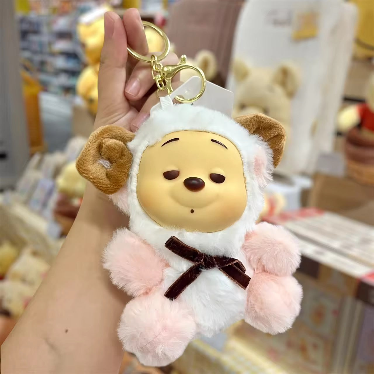 Winnie the Pooh keychain by Kxh Official Store featuring a cute plush figure with a metal keyring and chain attachment.