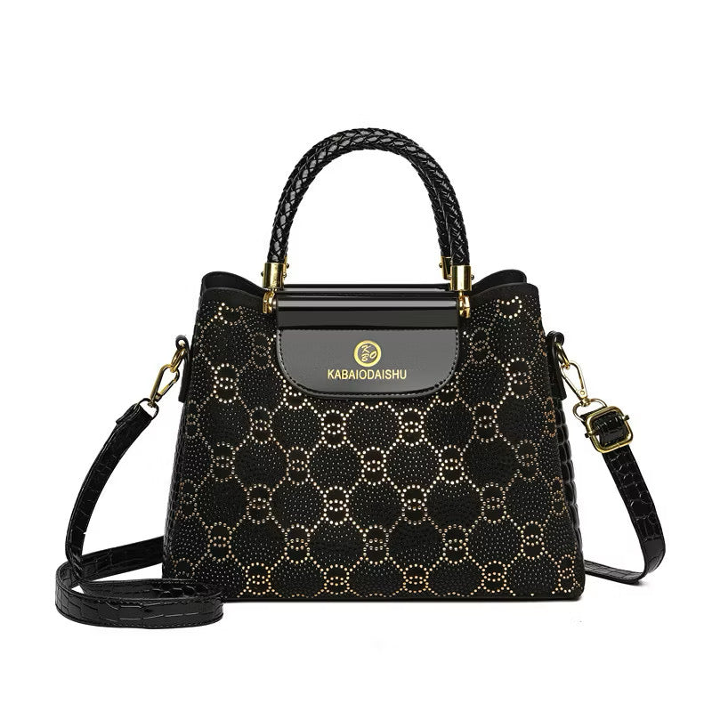 Geometric studded crossbody bag with bold design, featuring metallic accents and adjustable strap, by Kxh Official Store.