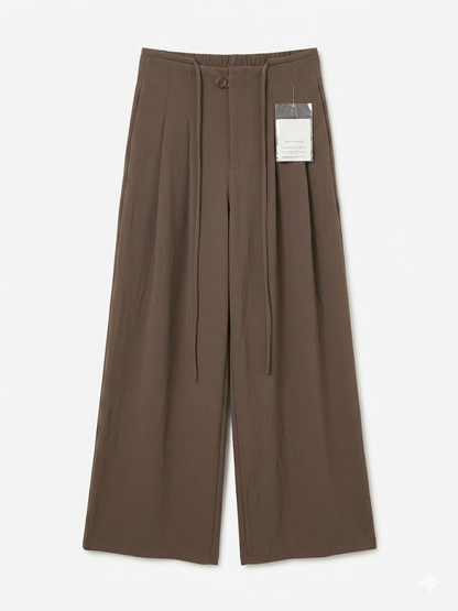 Wide-leg trousers from Kxh Official Store featuring a relaxed fit and effortless drape in neutral fabric.