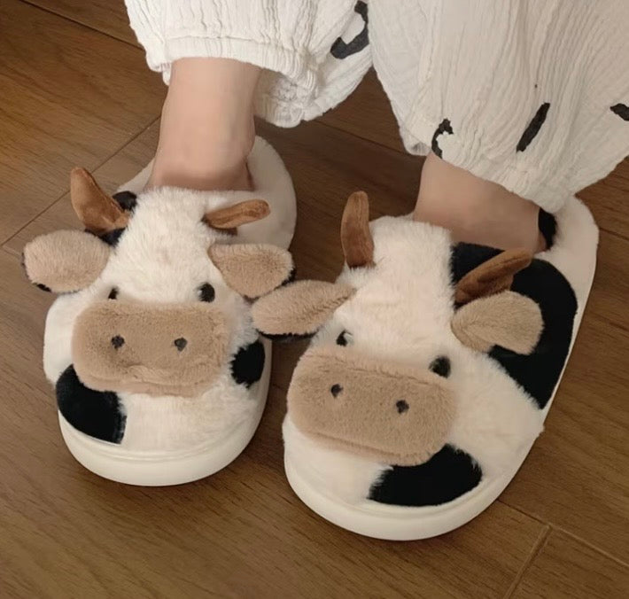 Kxh Official Store cow slipper showing soft, plush design with realistic cow print and comfortable slip-on style.