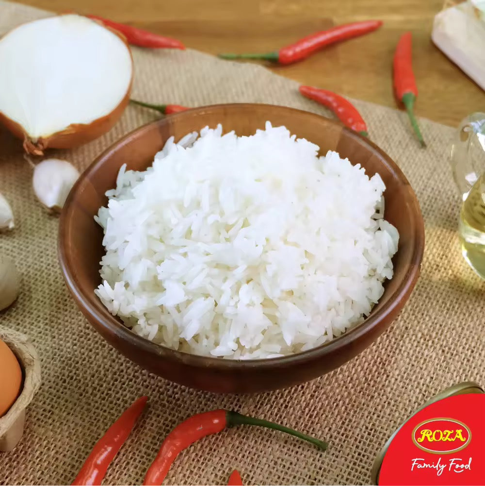 Steamed Jasmine rice from Roza prompt, served in a bowl, showcasing fluffy, aromatic grains perfect for Asian cuisine.