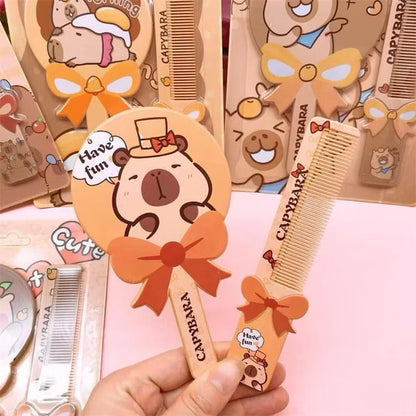 Capybara mirror and comb set by Kxh Official Store, featuring a cute capybara design on the mirror and grooming tools.