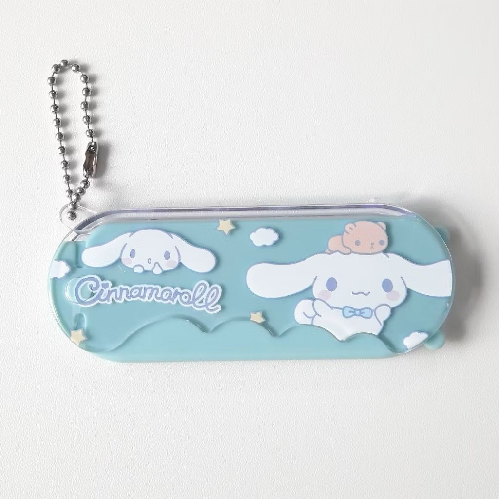 Sanrio Kuromi 2-in-1 compact comb and mirror keychain, featuring cute character design and portable size.
