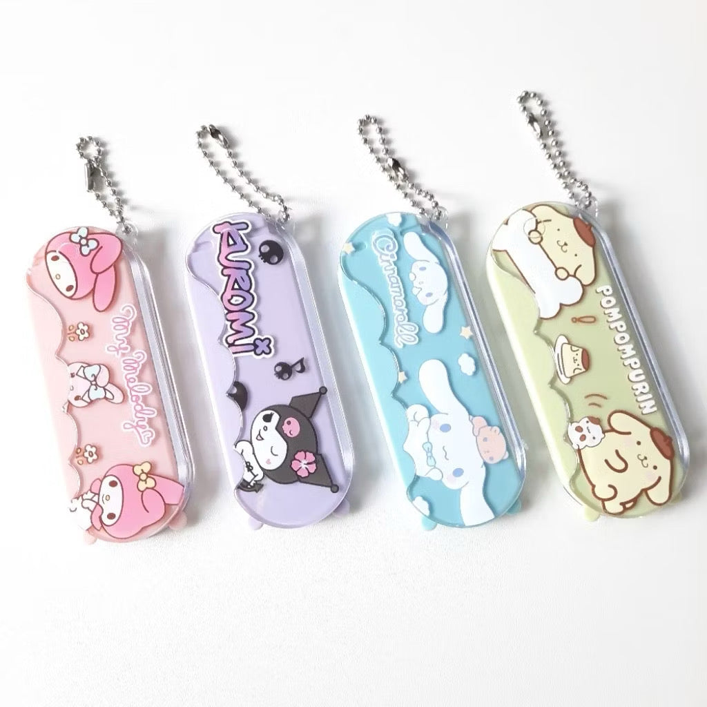 Sanrio Kuromi 2-in-1 compact comb and mirror keychains by Kxh Official Store, featuring cute character design in a portable size.
