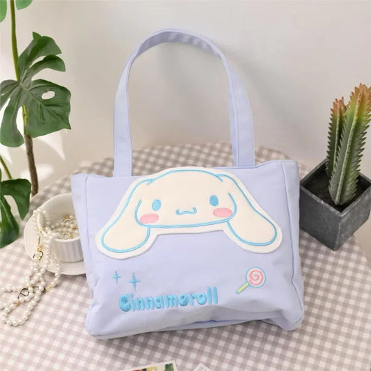 Kxh Official Store Sanrio Kuromi canvas tote bag with colorful character illustration and sturdy handles.