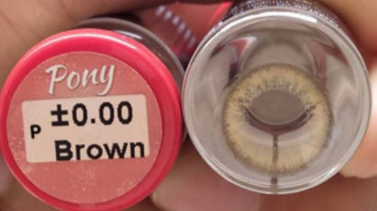 Close-up of clear contact lenses in a small container, showcasing the Kxh Official Store brand for eye vision correction.