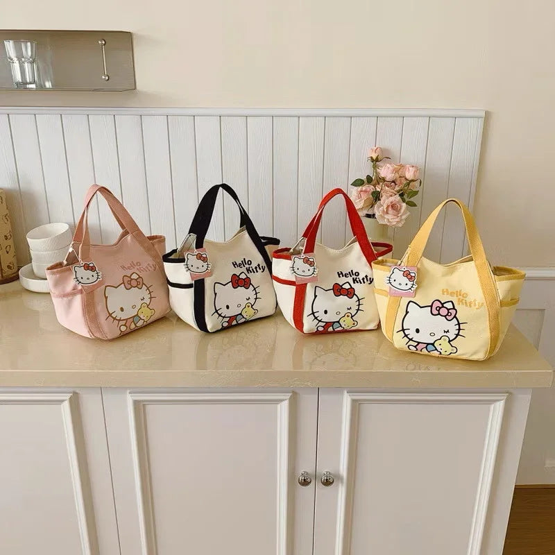 Pink Hello Kitty canvas mini tote bag by Kxh Official Store with cartoon character design and durable fabric.