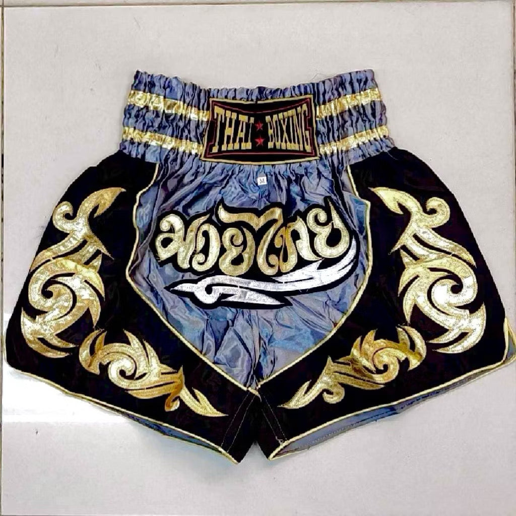 Pink adult Muay Thai shorts by Kxh Official Store with elastic waistband and bold design, suitable for training and competition.